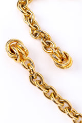 Gold metal vintage chain belt on white background textured end clusters @recessla