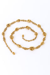 Gold metal vintage chain belt on white background in swirl @recessla