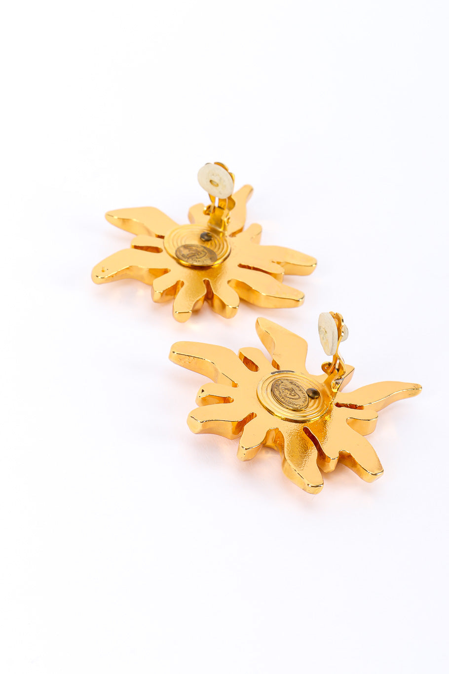 Sunburst earrings by Christian Lacroix on white background earring backs open @recessla