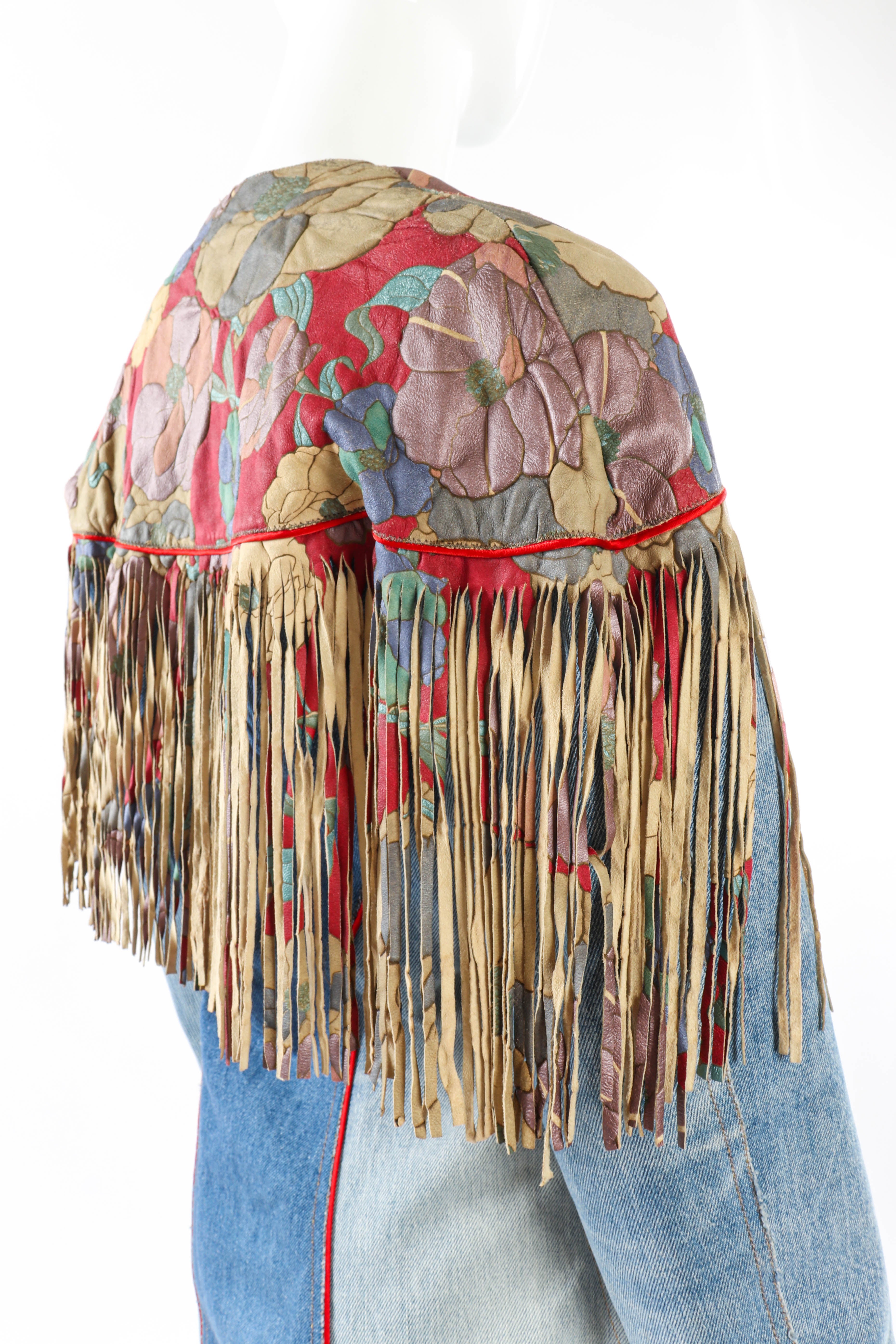 Vintage Roberto Cavalli Floral Denim and Leather Fringe Jacket 3/4 back on mannequin closeup @recessla