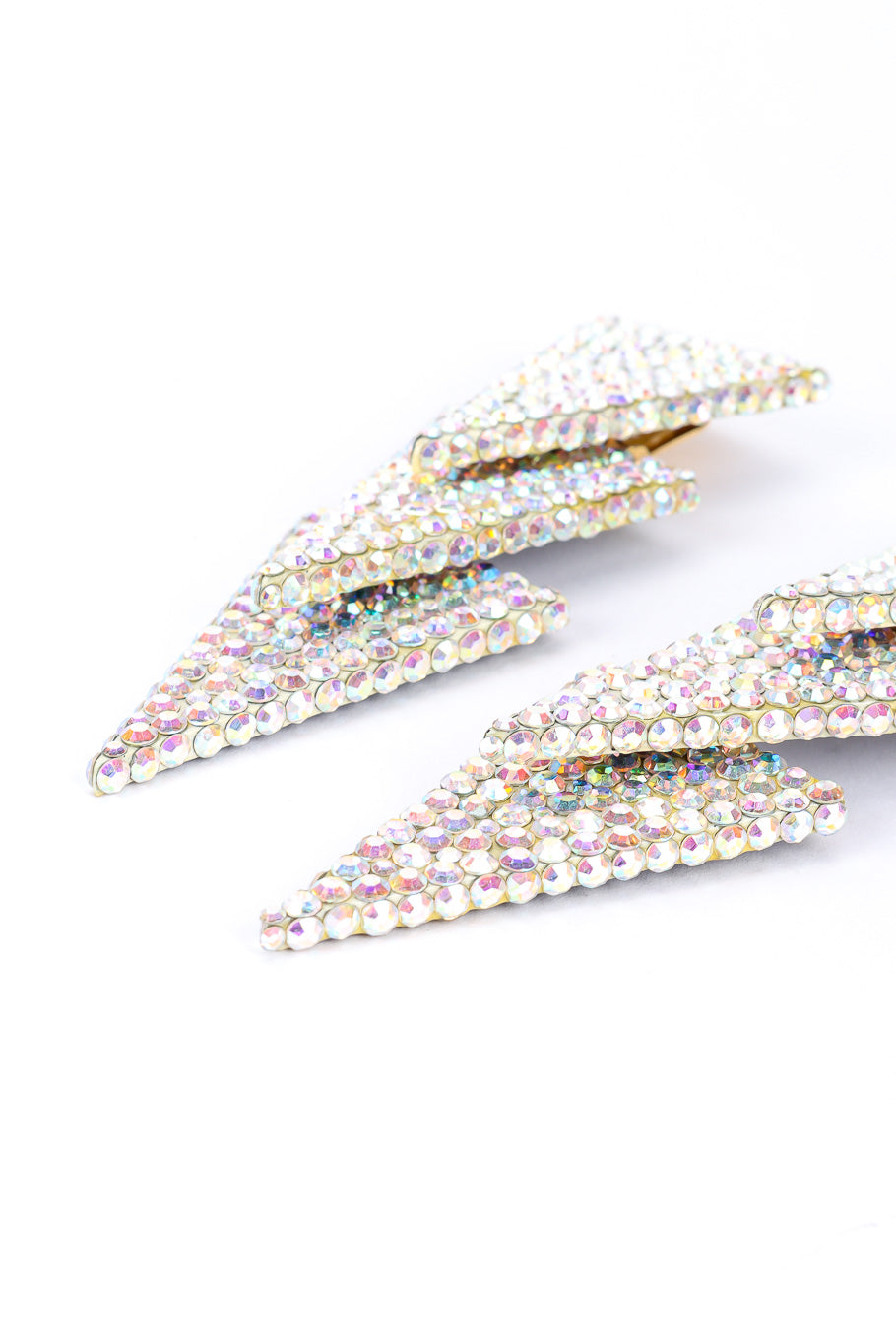 Spear drop earrings by Richard Kerr on white background from side @recessla