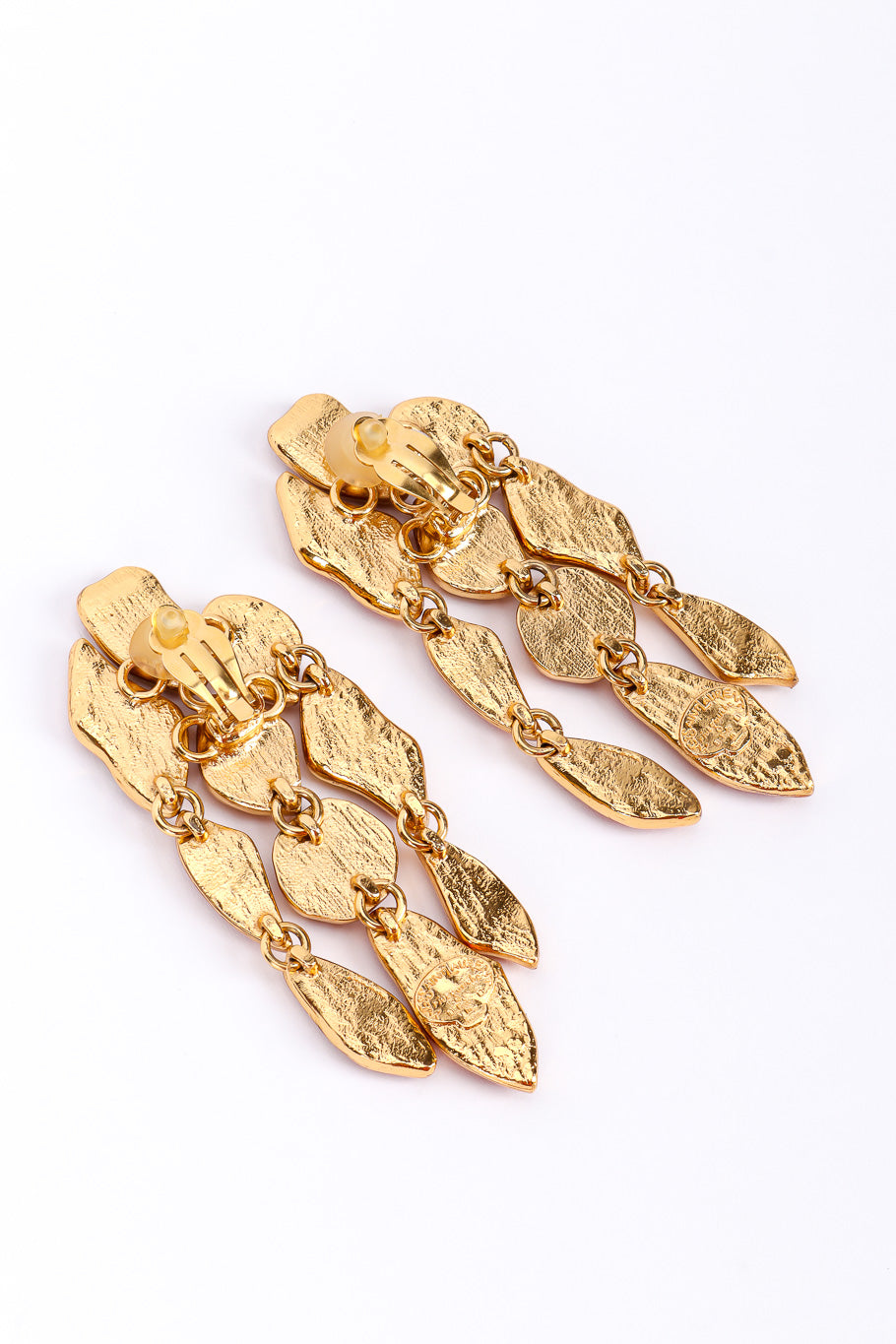 Chandelier earrings by Yves Saint Laurent on white background backs @recessla