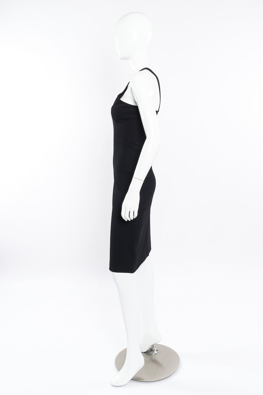 Black mini dress by Gucci on mannequin side @recessla