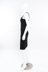 Black mini dress by Gucci on mannequin side @recessla