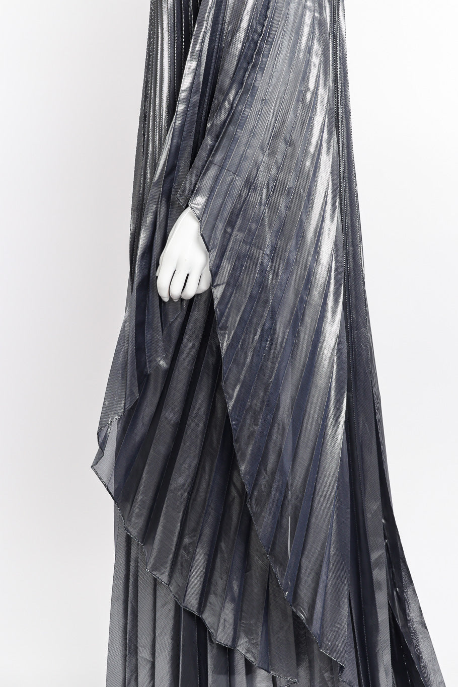 Metallic pleated caftan and bodysuit by Halston on mannequin hand close @recessla