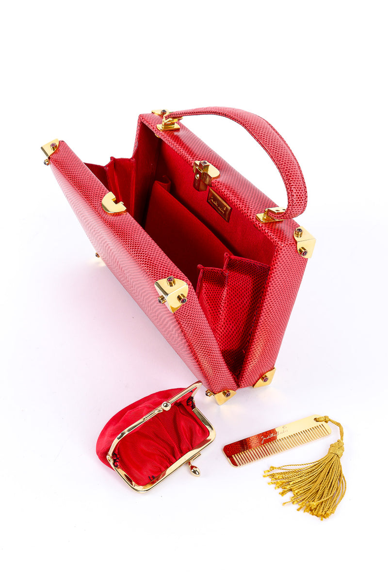 Leather handbag by Judith Leiber open with accessories @recessla