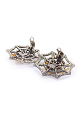 Spider earrings by Lorenz Paris on white background backs open @recessla