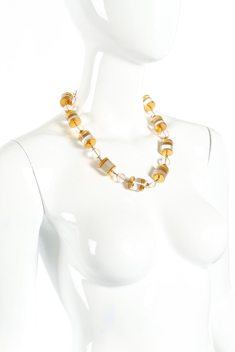 Lucite cylinder link necklace on white background on mannequin @recessla