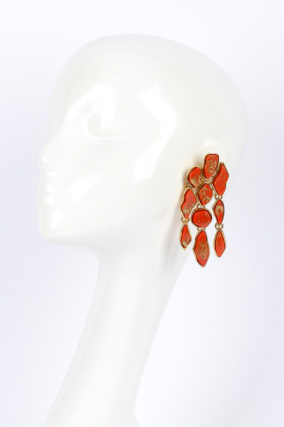 Chandelier earrings by Yves Saint Laurent on white background on mannequin @recessla