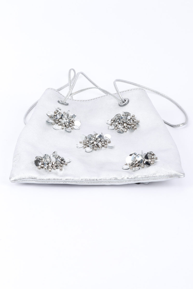 Miu Miu Metallic Drawstring Bag bottom edge view, laid flat on white backdrop @Recessla