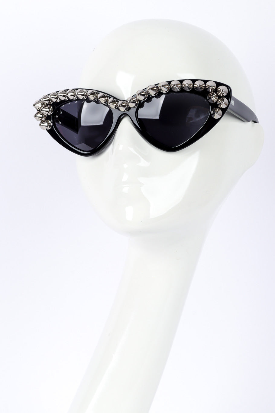 Spiked sunglasses by Moschino on white background on mannequin head @recessla