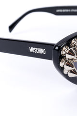 Spiked sunglasses by Moschino on white background signature @recessla