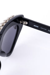 Spiked sunglasses by Moschino on white background inner hinge @recessla