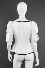 Balloon sleeve peplum top by Yves Saint Laurent on mannequin back @recessla