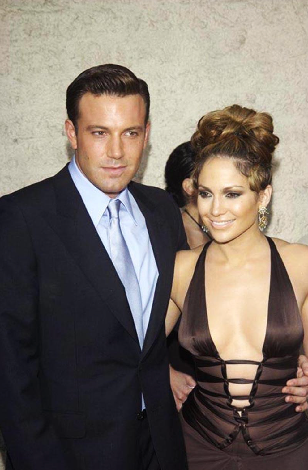 Halter dress in brown on Jennifer Lopez with Ben Affleck at the Gigli film premiere on July 27th 2003. Jim Smeal/BEI/Shutterstock