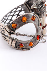 Vintage Equestrian Motif Magnet Bracelet horseshoe with glass beads closeup on a white backdrop @Recessla