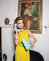 Vintage Crystal Cabochon Button Earrings on model with phone @recess la