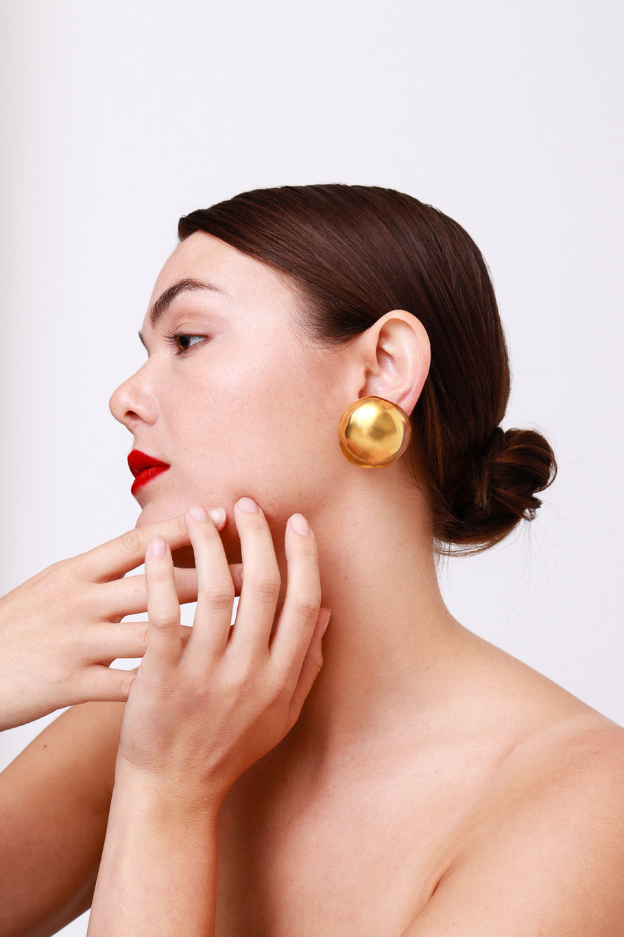 Vintage Golden Lucite Domed Button Earrings model @RECESS LA