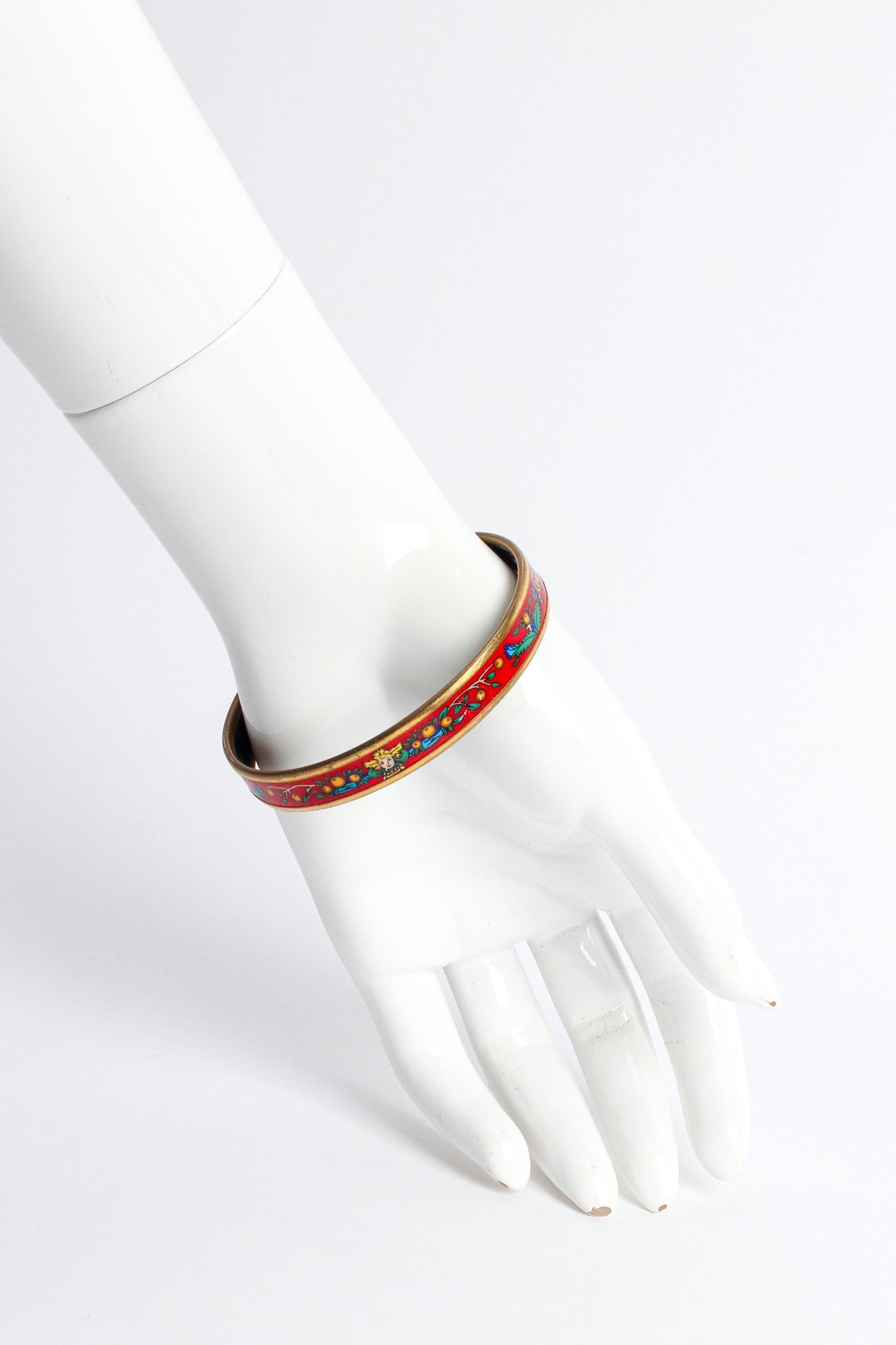 Vintage Hermés Peacock Fern Narrow Enamel Bracelet on mannequin wrist @ Recess LA