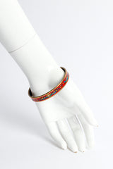 Vintage Hermés Peacock Fern Narrow Enamel Bracelet on mannequin wrist @ Recess LA