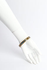 Vintage Hermés Tropical Fish Narrow Enamel Bracelet on mannequin wrist @ Recess LA