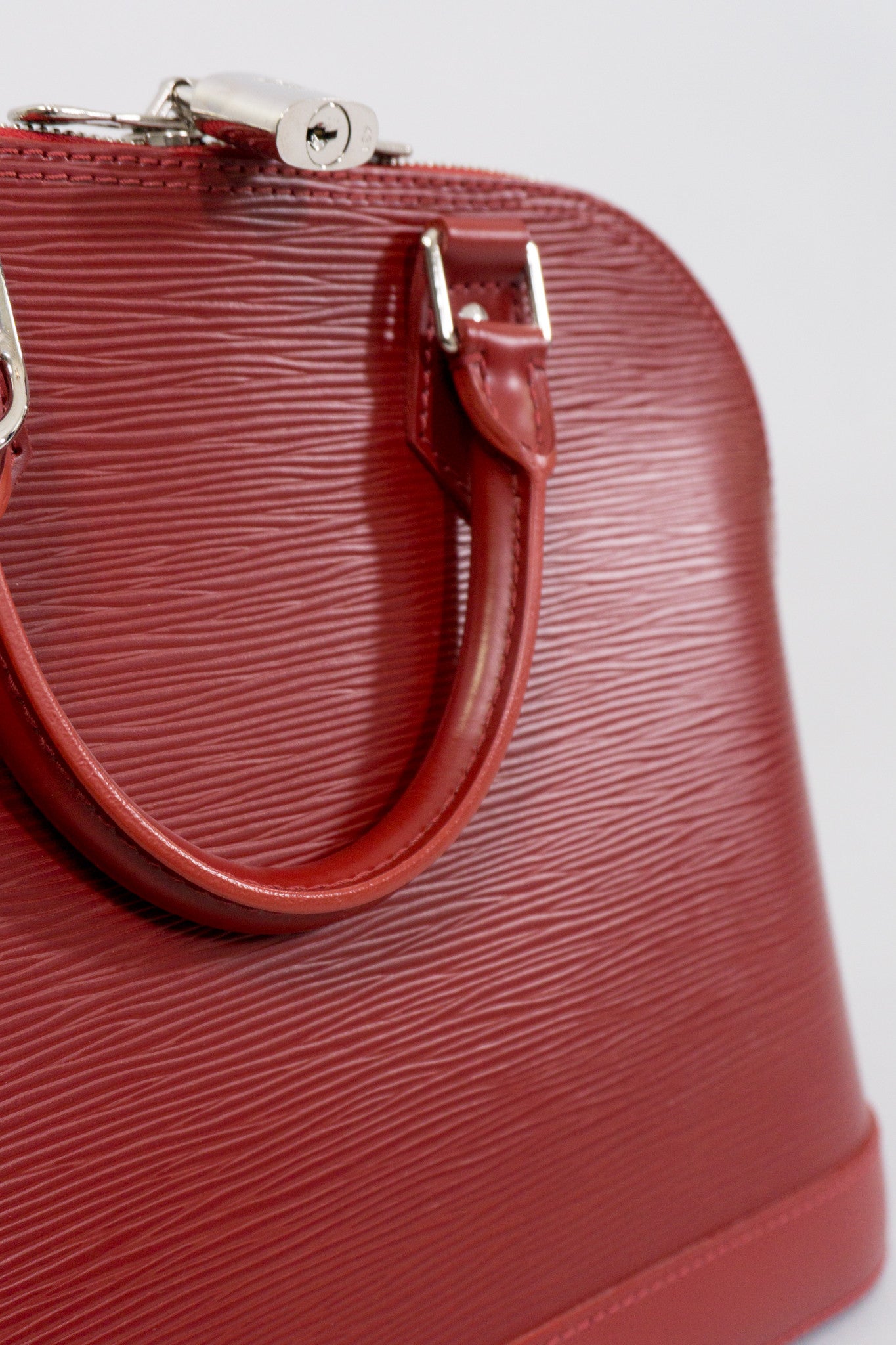 Louis Vuitton Epi Alma NM Handbag in Rubis Red