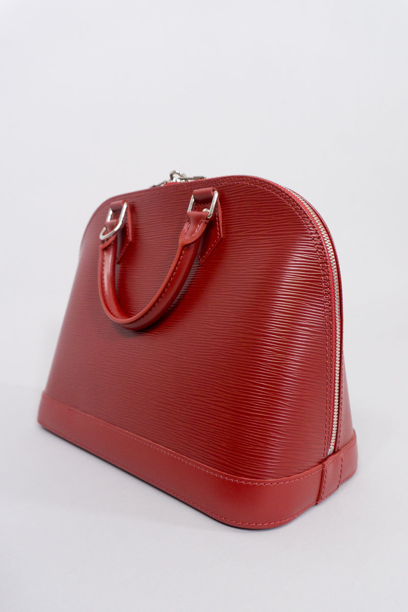 Louis Vuitton Epi Alma NM Handbag in Rubis Red