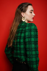 girl in Vintage Chanel Bouclé Plaid Tweed Wrap Jacket & chain belt on red at Recess Los Angeles