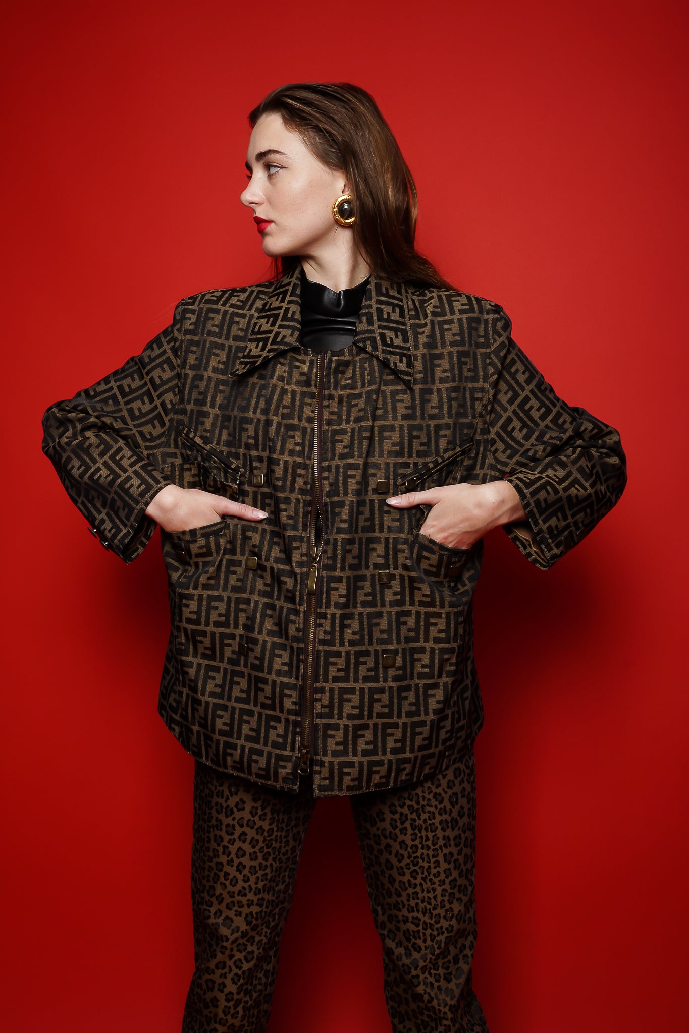 girl in Vintage Fendi Zucca Monogram Zip Swing Jacket on red background @ Recess Los Angeles