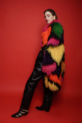 Girl in Vintage Neiman Marcus Rainbow Mosaic Mongolian Fur Coat on red background @ Recess LA