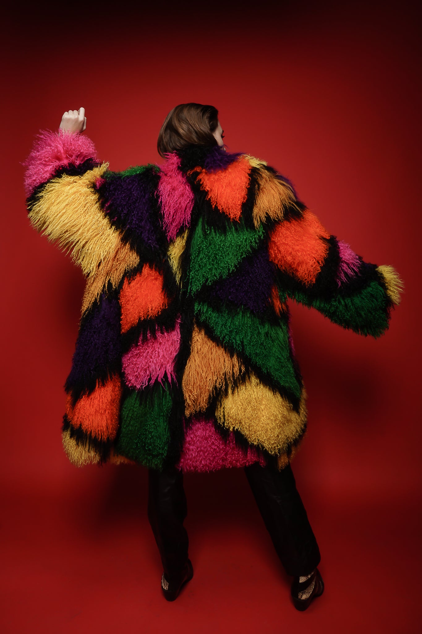 Girl in Vintage Neiman Marcus Rainbow Mosaic Mongolian Fur Coat on red background @ Recess LA