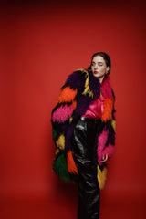 Girl in Vintage Neiman Marcus Rainbow Mosaic Mongolian Fur Coat on red background @ Recess LA