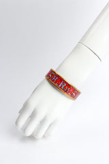 Vintage Hermés Animal Alphabet Wide Enamel Bracelet on mannequin wrist @ Recess LA