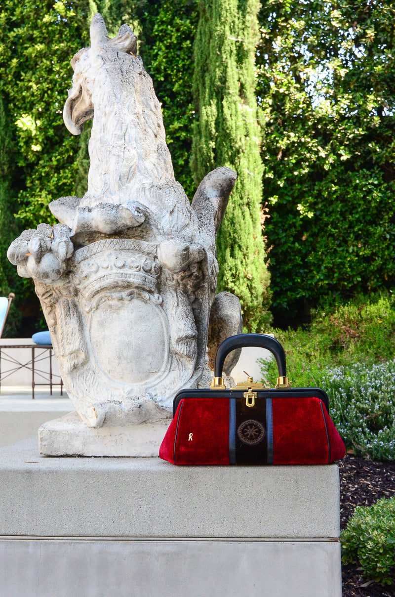 Roberta di Camerino Velvet Stripe Doctor Bagonghi Bag Pictured in a Garden at Recess LA