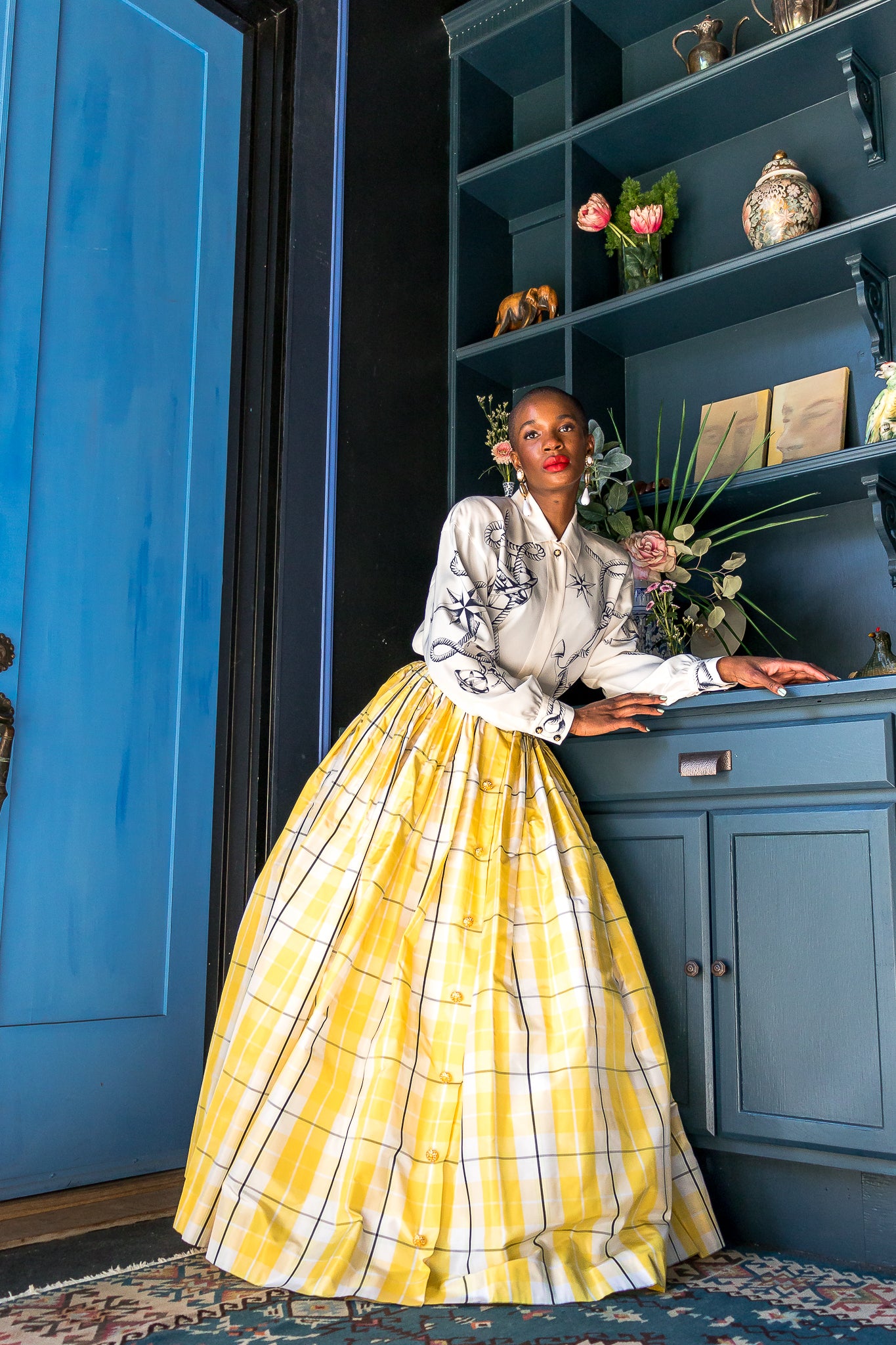 Monica Ahanonu in Vintage Escada Plaid Taffeta Ball Skirt with blue door at Recess Los Angeles