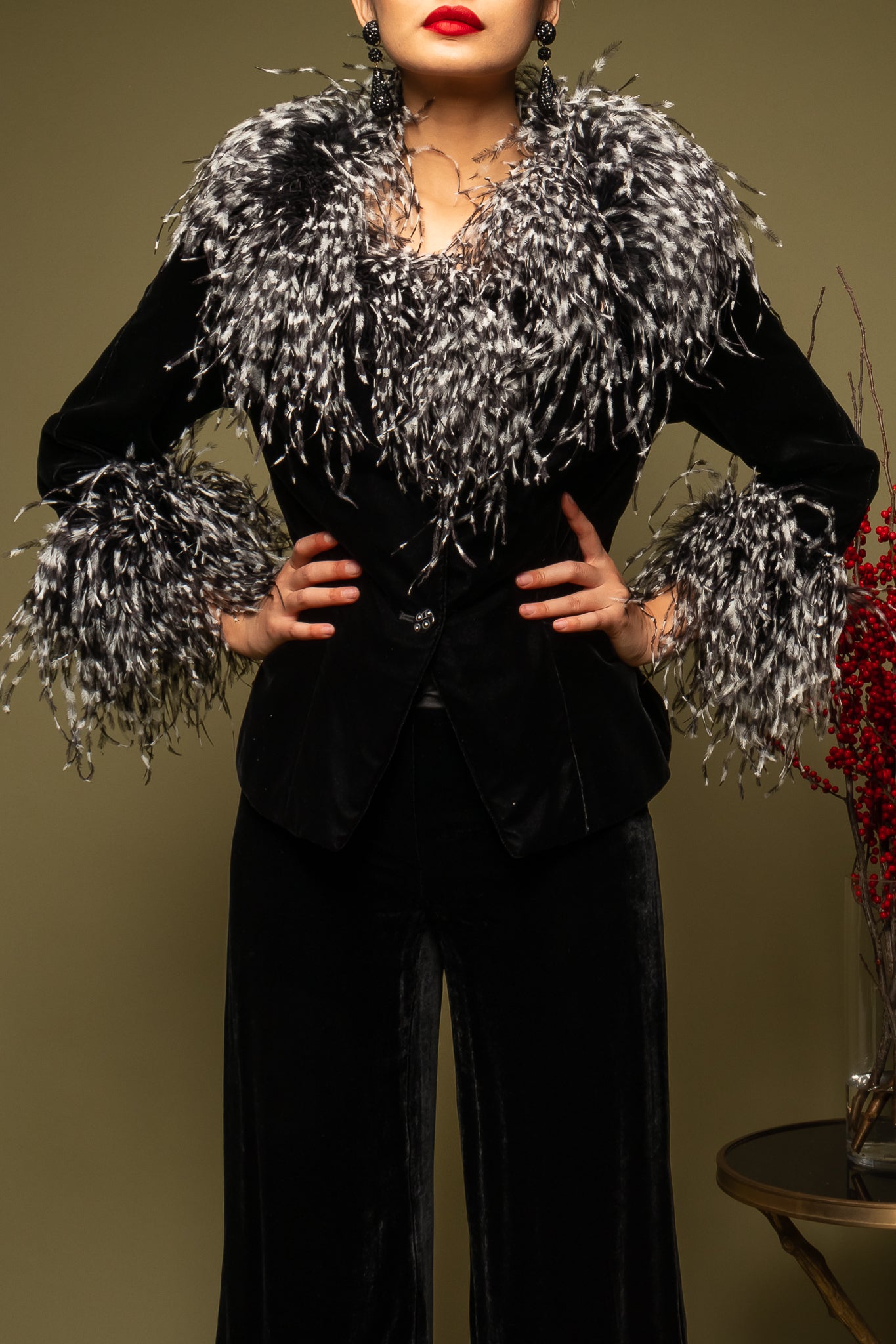 girl in Vintage Bob Mackie Velvet Ostrich Feather Jacket on olive green backdrop at Recess LA