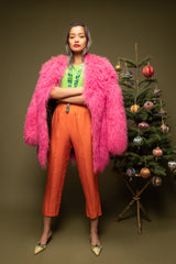 girl in Vintage Krizia Pink Mongolian Fur Coat w/ Escada top & Orange pant on olive @ Recess LA