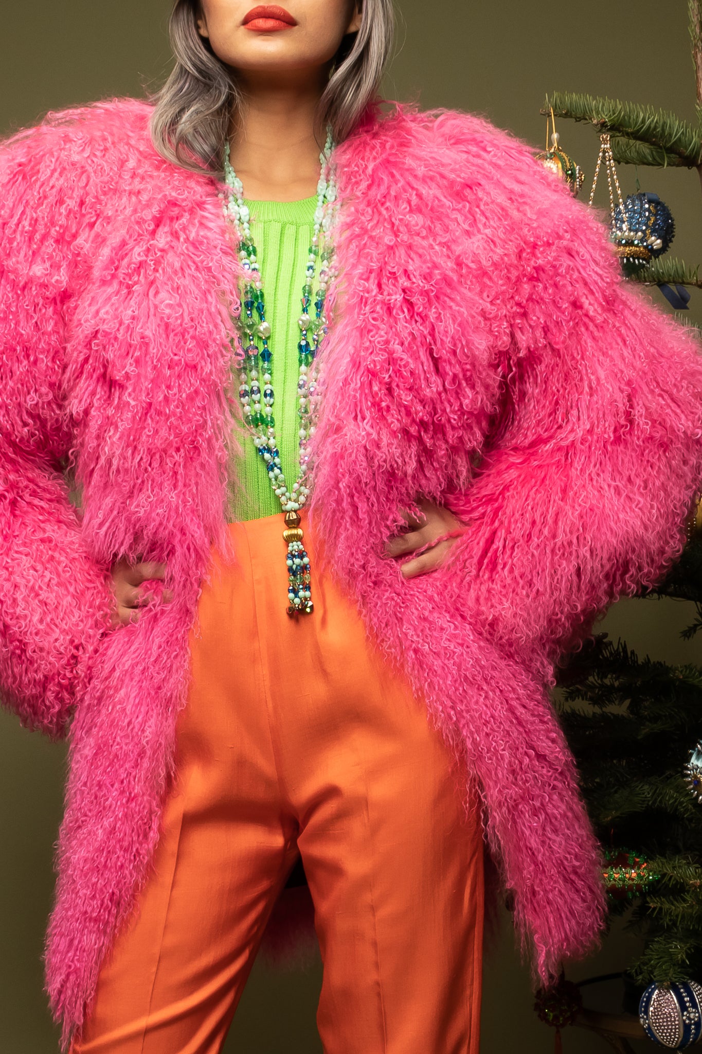 girl in Vintage Krizia Pink Mongolian Fur Coat w/ Escada top & Orange pant on olive @ Recess LA