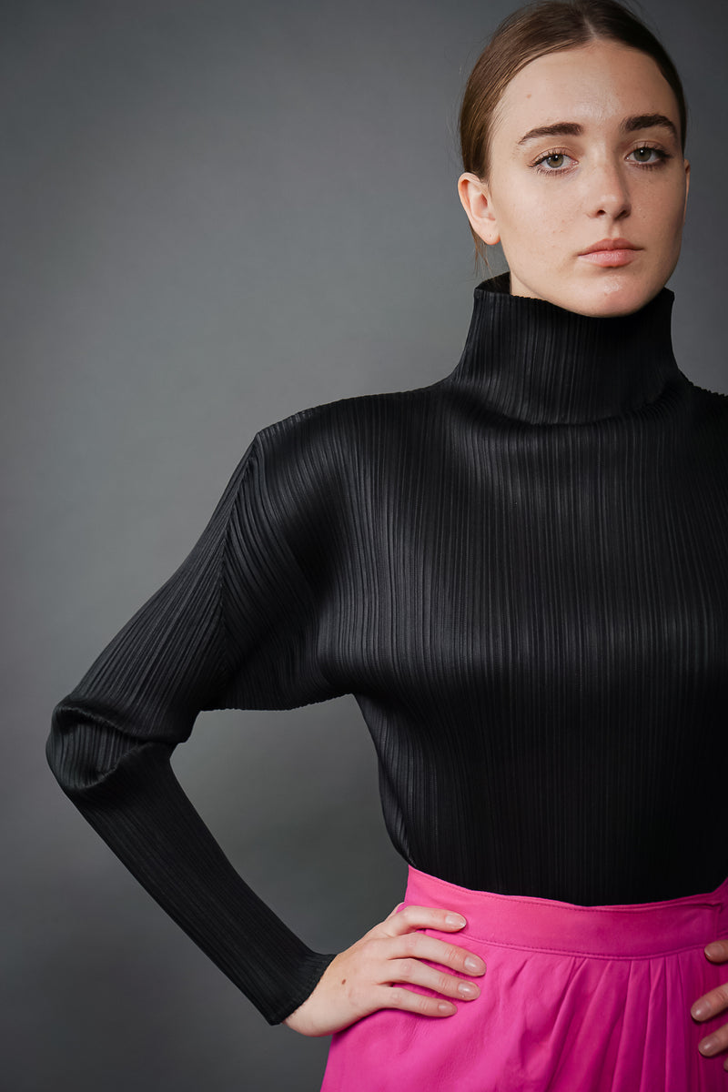 Girl in Vintage Issey Miyake Pleats Please Pleated Turtleneck Top at Recess Los Angeles