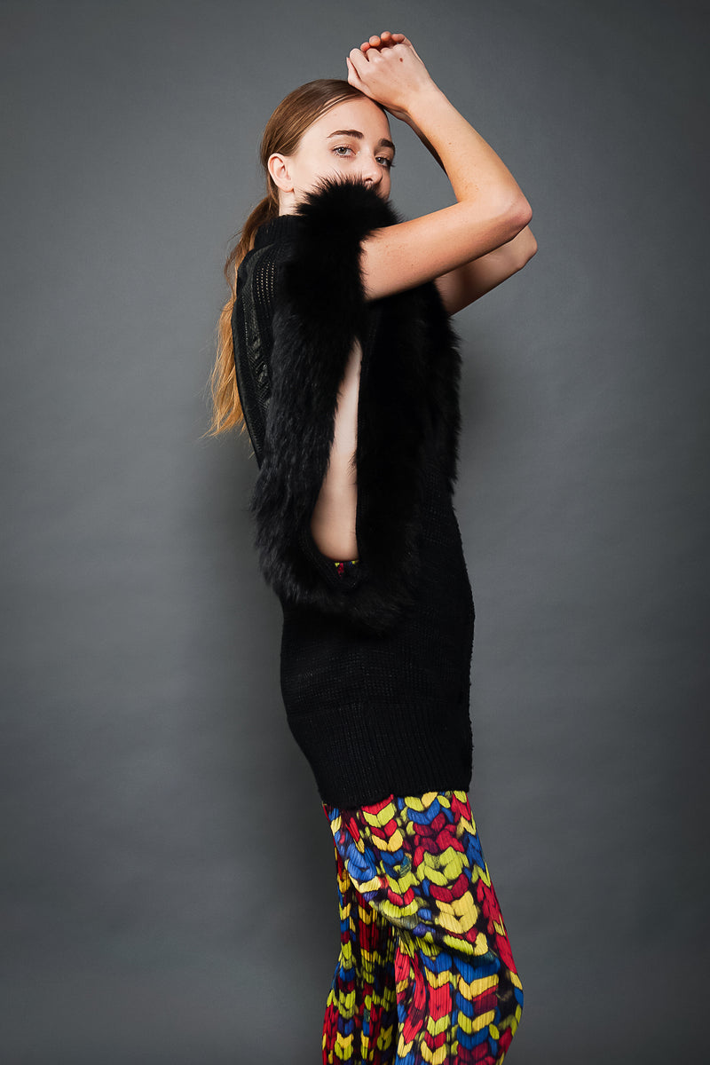 Girl in Vintage Delaware Street Long Fur Snake Trim Knit Vest and chevron pant at Recess LA