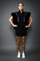 Girl in Vintage Delaware Street Long Fur Snake Trim Knit Vest and chevron pant at Recess LA