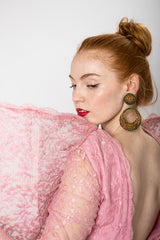 Iridescent vintage hoop earrings on model @recessla