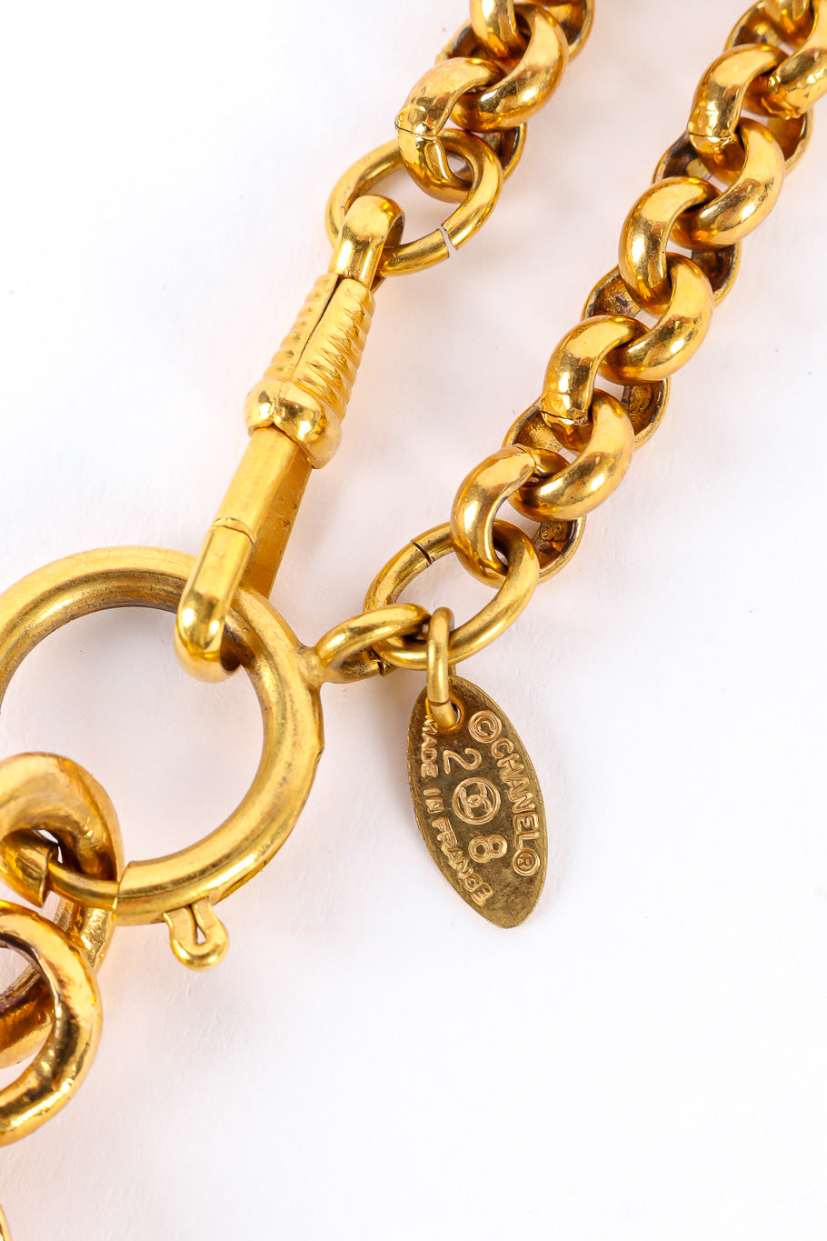 Statement gold pendant necklace by Chanel cartouche close @recessla