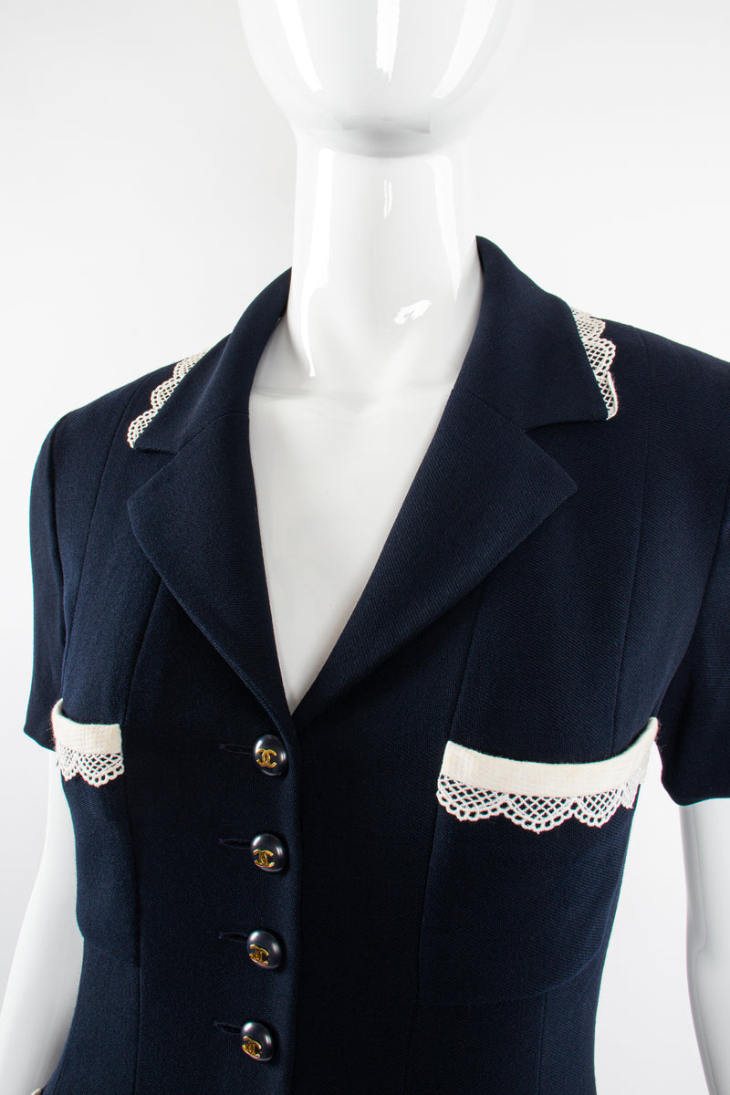 Vintage Chanel 1995C Lace Trim Pleated Uniform Dress on Mannequin collar at Recess Los Angeles