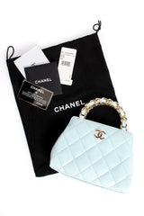 Vintage Chanel Powder Blue Quilted Mini Tote dustbag authenticity card at Recess Los Angeles