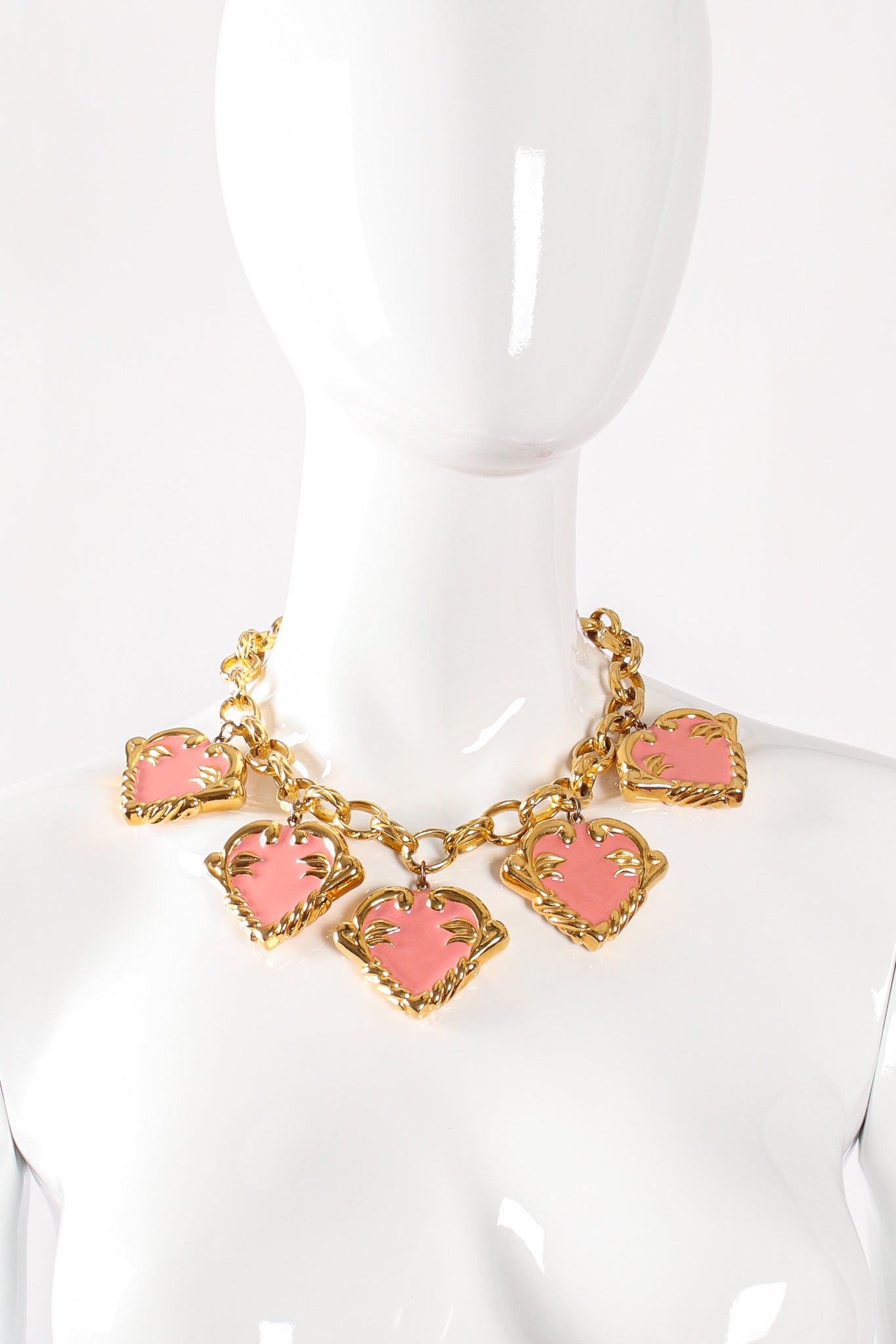 Vintage Escada Pink Enamel Hearts Charm Necklace on mannequin at Recess Los Angeles