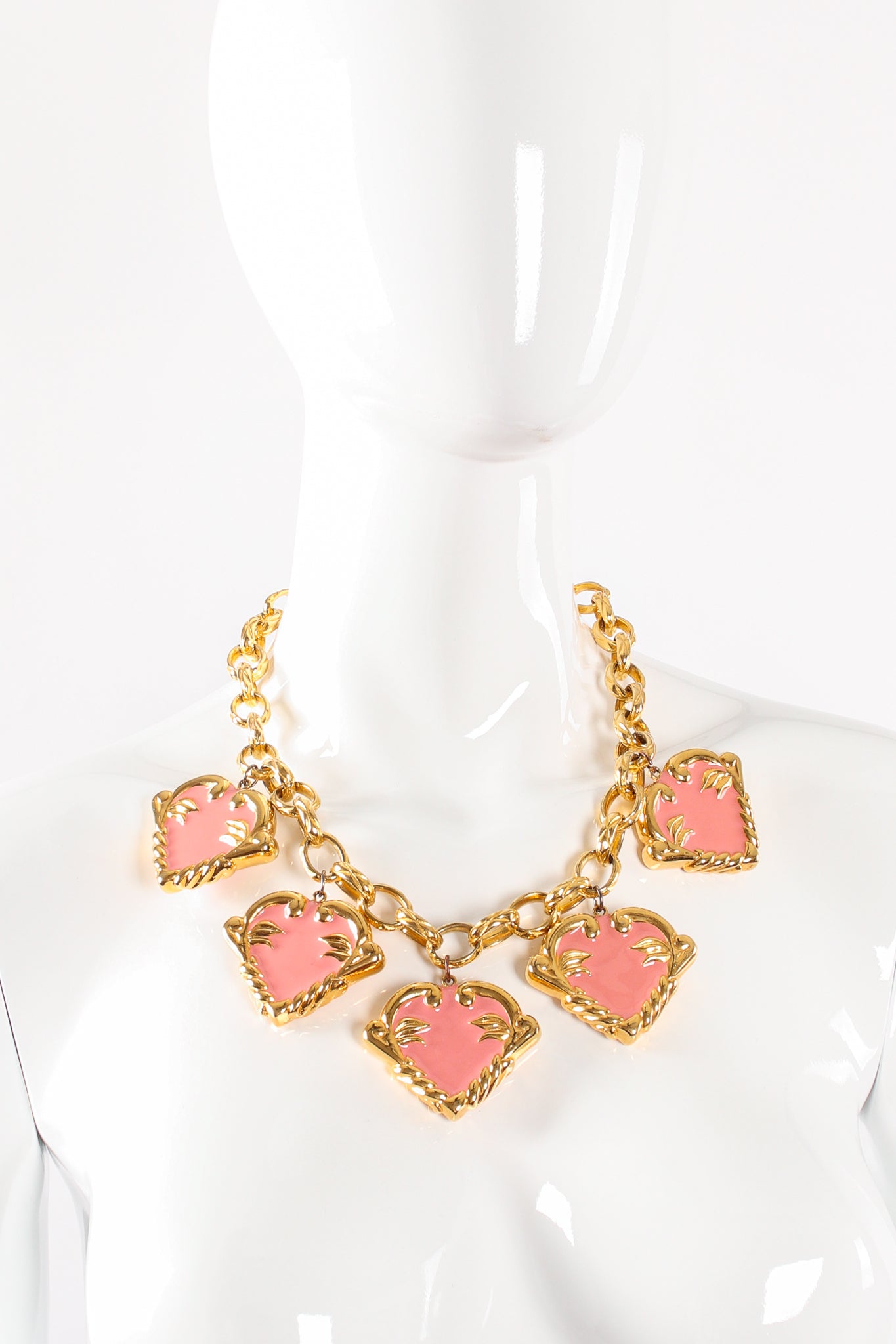 Vintage Escada Pink Enamel Hearts Charm Necklace on mannequin at Recess Los Angeles