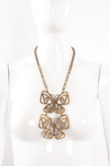 Vintage Brass Double Butterfly Necklace on mannequin at Recess Los Angeles