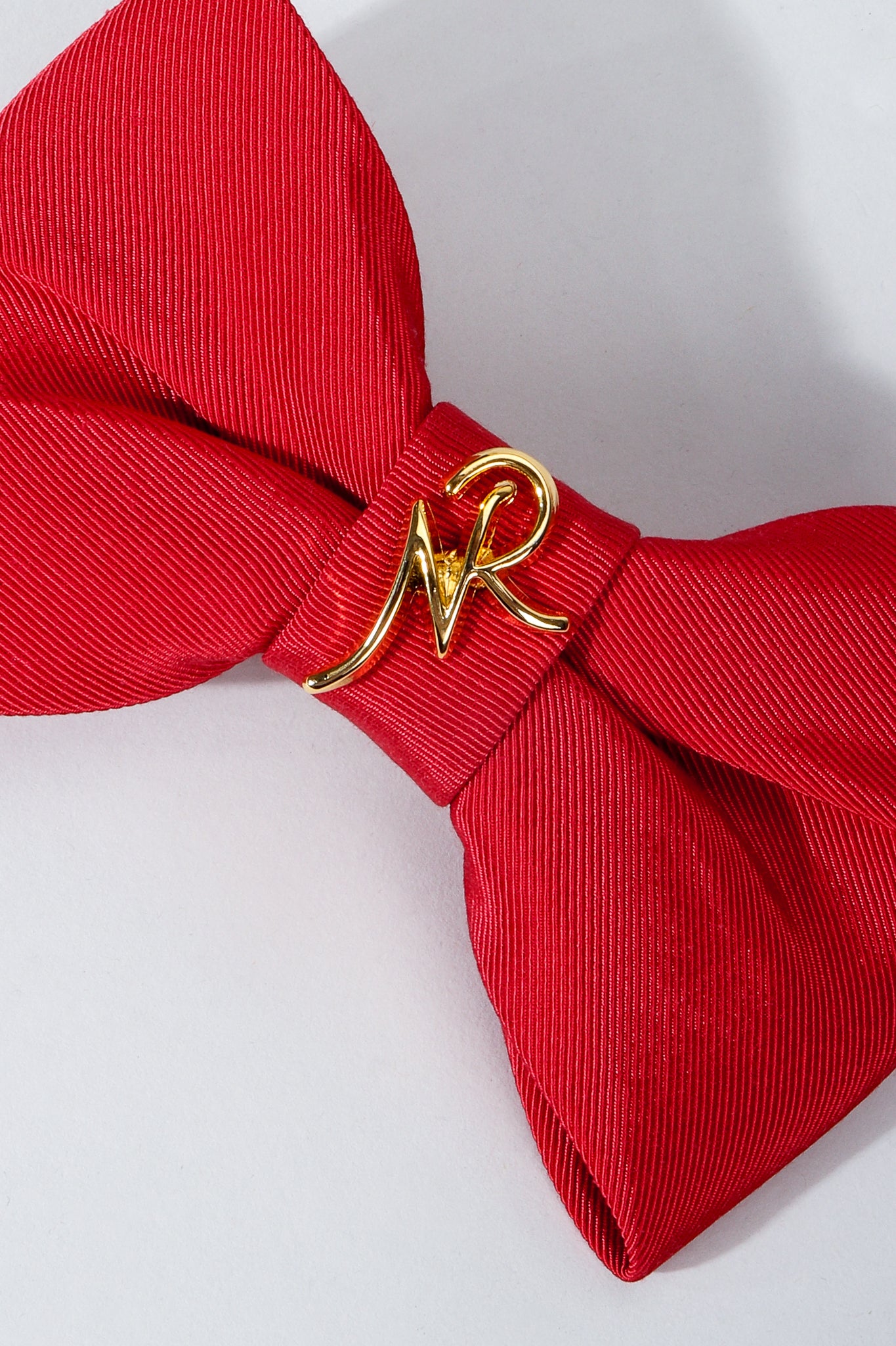 Vintage Nina Ricci Red Logo Bow Barrette Hair Clip on Grey at Recess Los Angeles Cropped