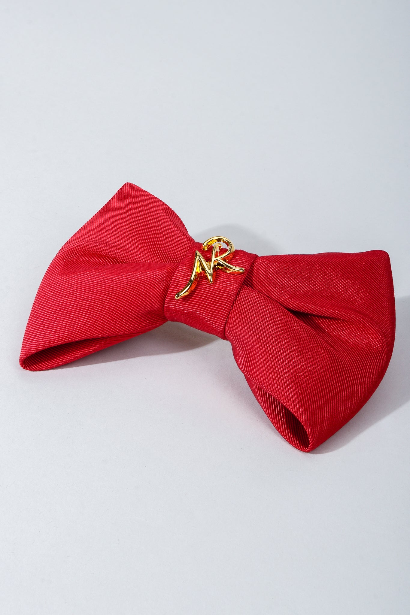 Vintage Nina Ricci Red Logo Bow Barrette Hair Clip on Grey at Recess Los Angeles